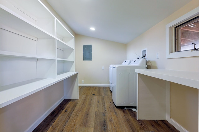 washroom featuring dark hardwood / wood-style floors, washing machine and dryer, and electric panel