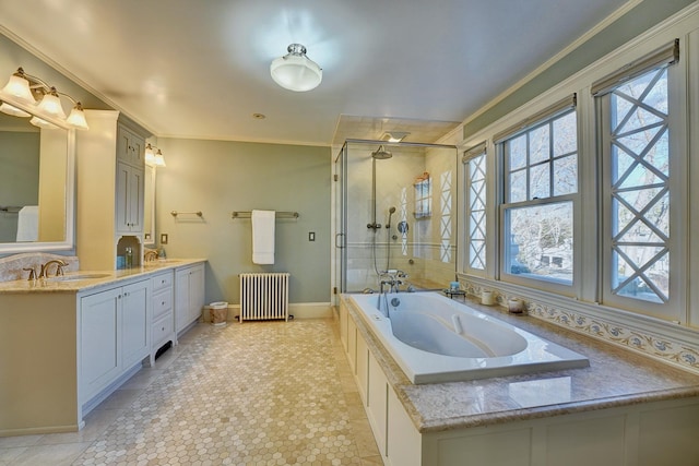 bathroom with vanity, crown molding, radiator heating unit, and shower with separate bathtub