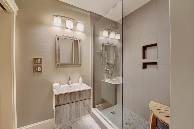 bathroom featuring tile patterned floors, vanity, and a shower with door