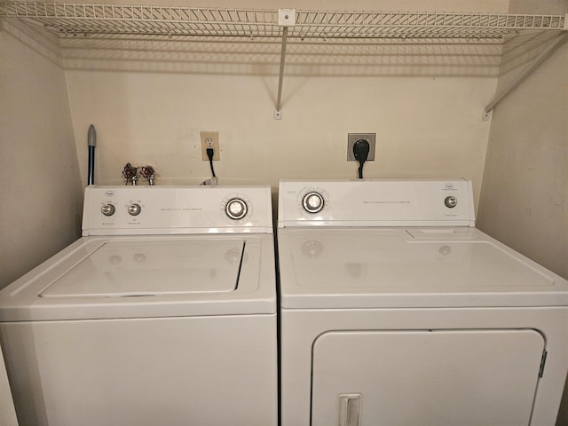 clothes washing area featuring washing machine and dryer