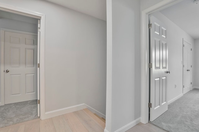 corridor with light colored carpet