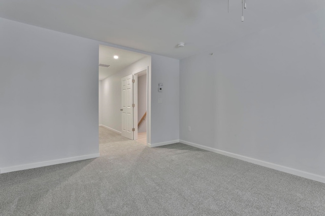 empty room featuring light colored carpet