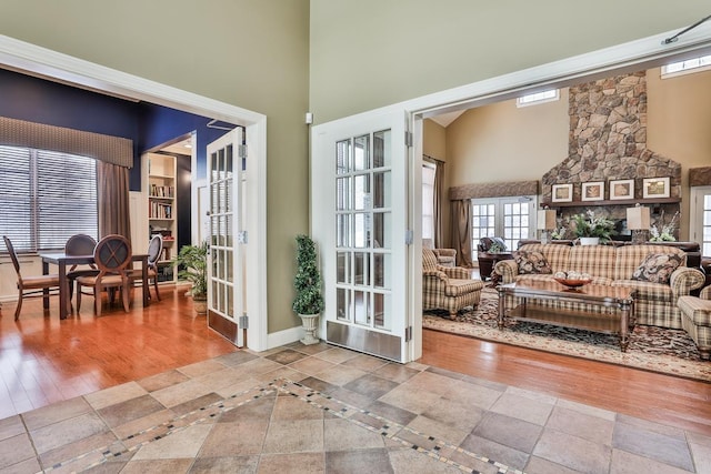 doorway to outside with a high ceiling and french doors