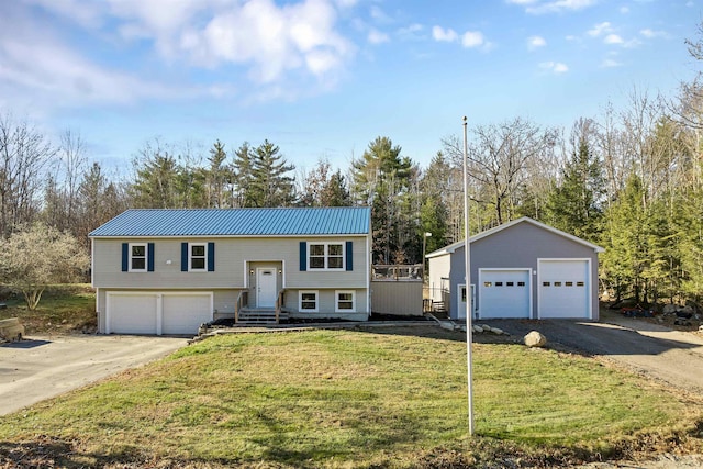 bi-level home featuring a front yard and a garage