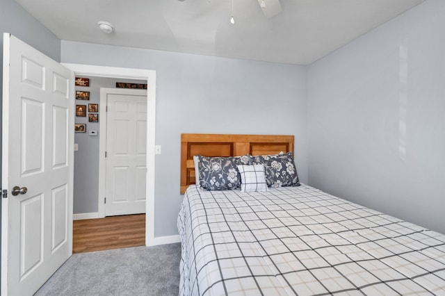 bedroom with ceiling fan and carpet floors