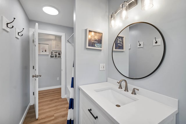 bathroom featuring hardwood / wood-style floors and vanity