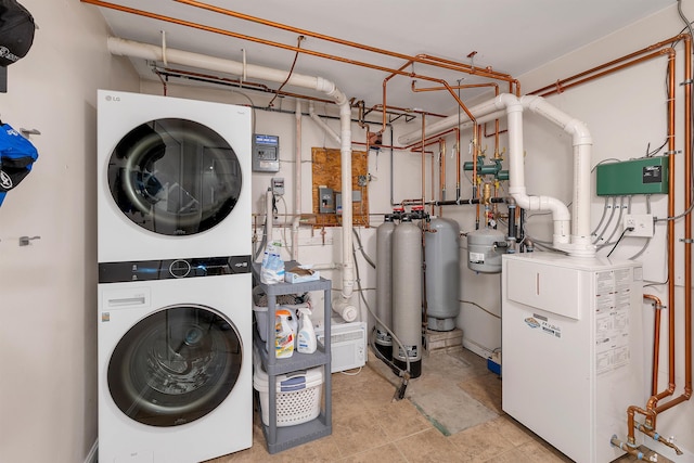 laundry area featuring stacked washing maching and dryer