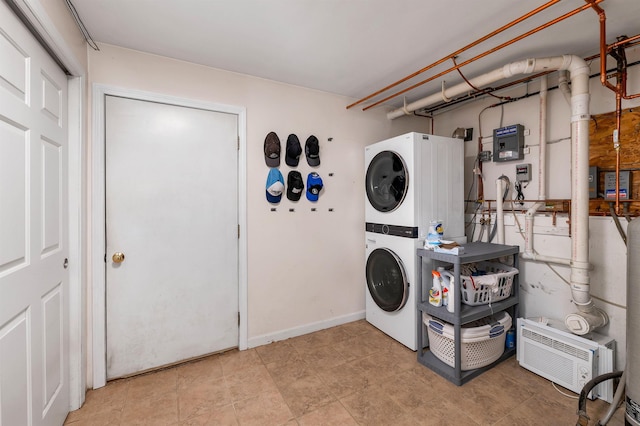 clothes washing area with stacked washer / drying machine