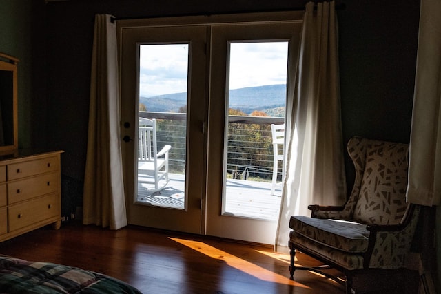 entryway featuring a mountain view, dark hardwood / wood-style floors, and french doors