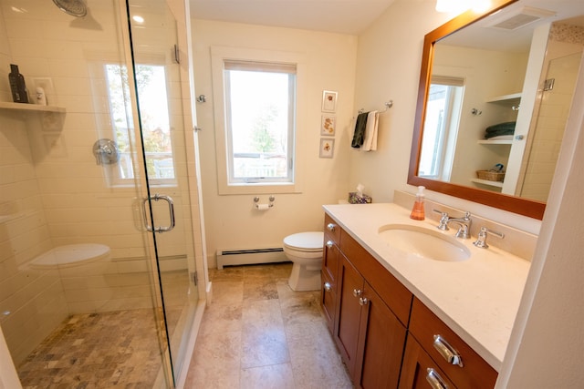 bathroom with vanity, a baseboard radiator, toilet, and an enclosed shower