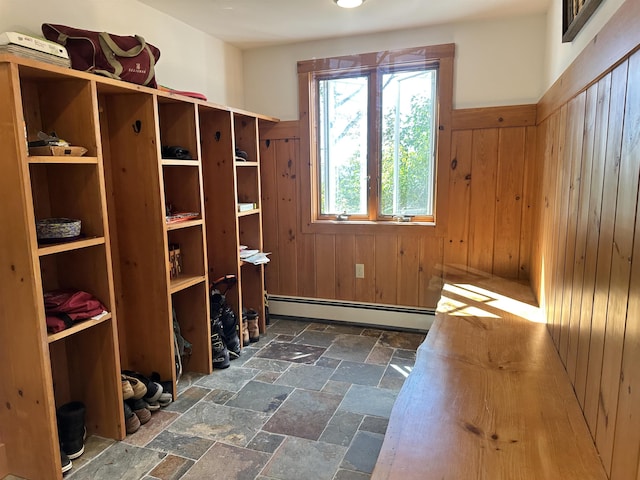 mudroom featuring wood walls and baseboard heating