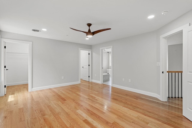 empty room featuring light wood-type flooring and ceiling fan