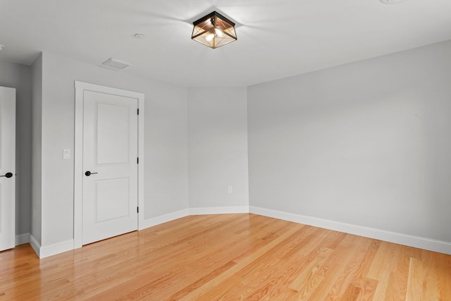 unfurnished room featuring hardwood / wood-style floors