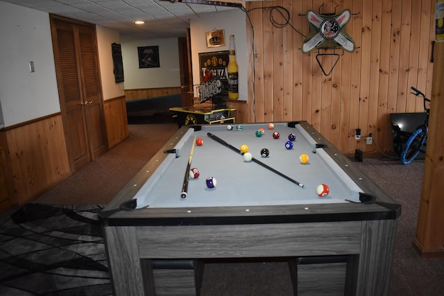 rec room with carpet, pool table, and wooden walls