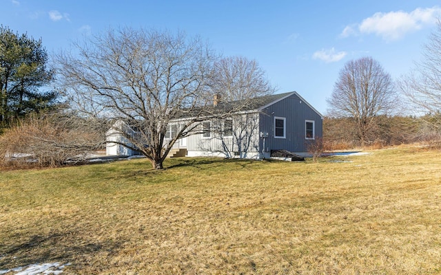 view of home's exterior with a yard