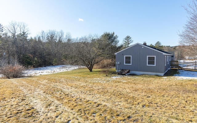 view of property exterior featuring a yard and a water view