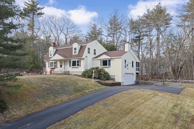 view of front of house with a front yard and a garage