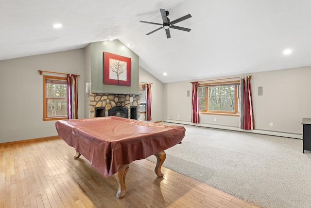 playroom featuring hardwood / wood-style floors, ceiling fan, a fireplace, and pool table