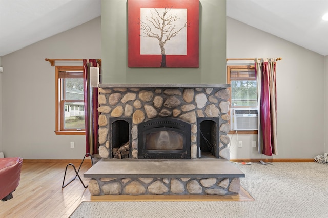 details with wood-type flooring, a stone fireplace, and cooling unit