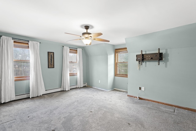 carpeted spare room with ceiling fan and lofted ceiling