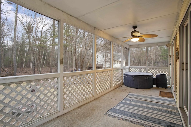 sunroom featuring ceiling fan