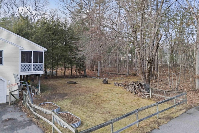 view of yard featuring a sunroom