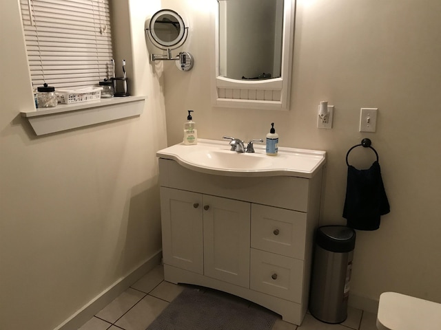 bathroom with tile patterned floors and vanity