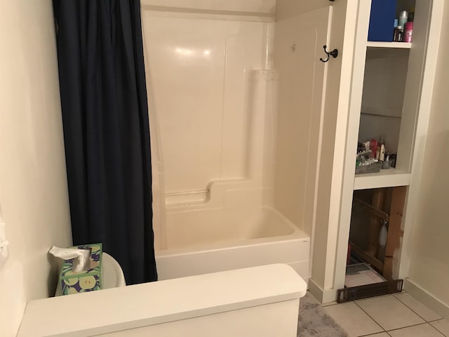 bathroom with tile patterned floors and shower / tub combo