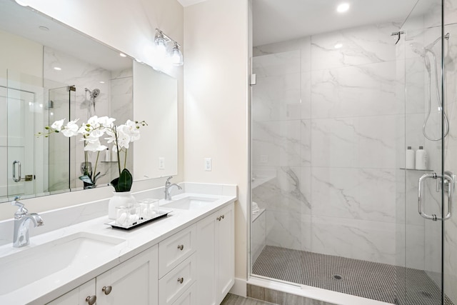 bathroom with vanity and an enclosed shower