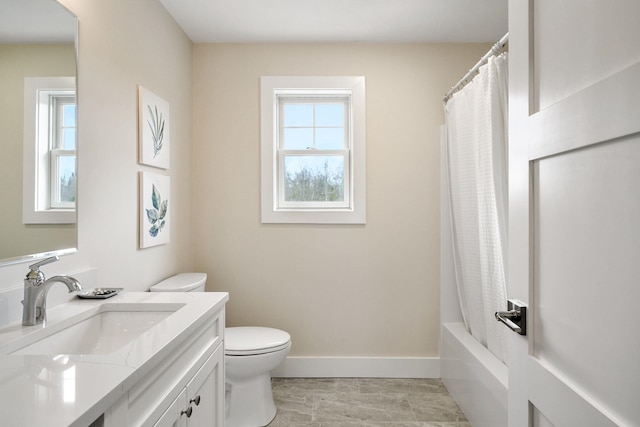 full bathroom with shower / bath combination with curtain, vanity, a healthy amount of sunlight, and toilet