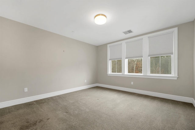 unfurnished room with carpet flooring