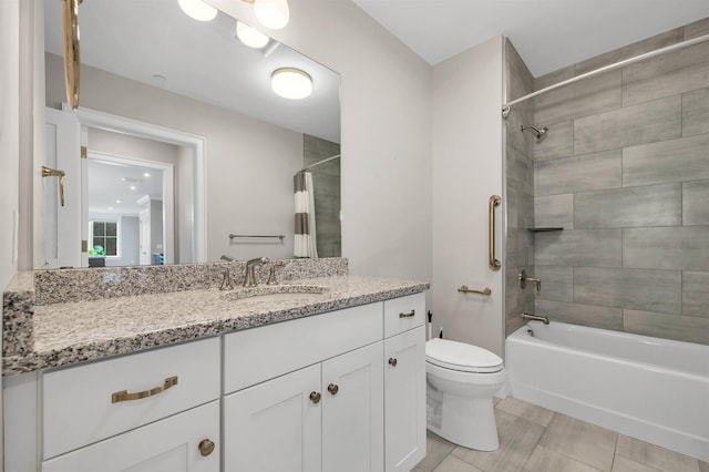 full bathroom featuring tile patterned floors, shower / bath combo, toilet, and vanity