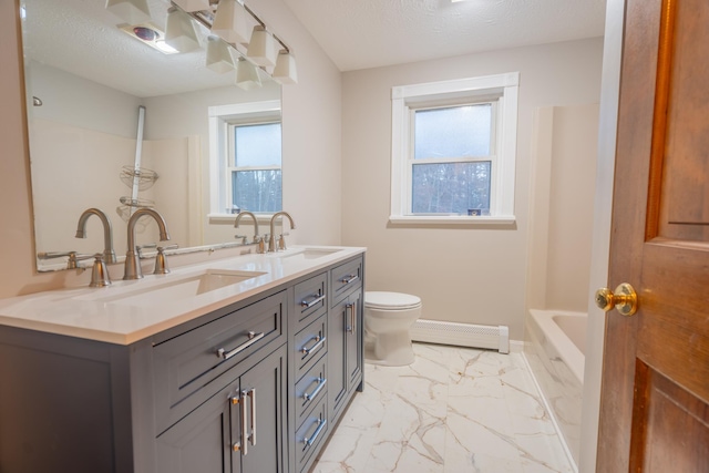 bathroom with vanity, a baseboard radiator, a textured ceiling, and toilet