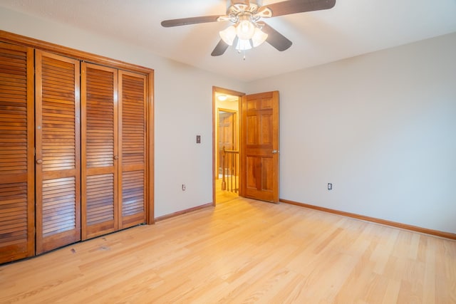 unfurnished bedroom featuring light wood-type flooring, a closet, and ceiling fan