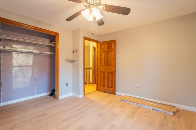 unfurnished bedroom featuring light wood-type flooring, a closet, and ceiling fan