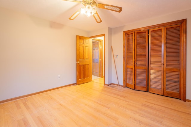 unfurnished bedroom featuring ceiling fan and light wood-type flooring