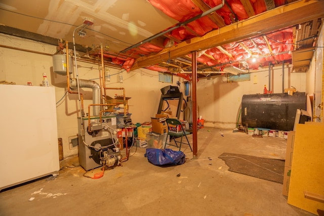 basement with white refrigerator