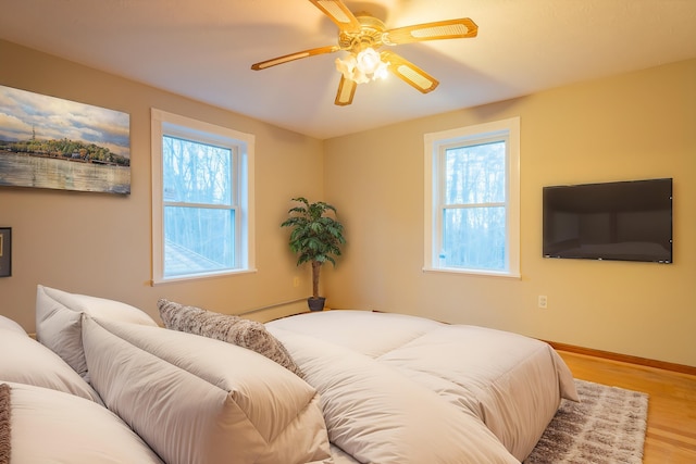 bedroom featuring ceiling fan and wood-type flooring