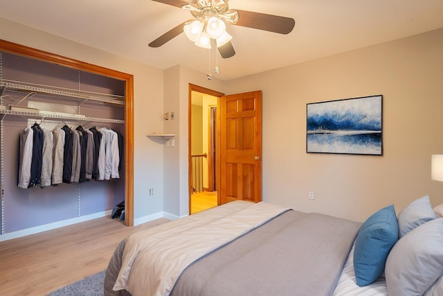 bedroom with a closet, ceiling fan, and light hardwood / wood-style floors