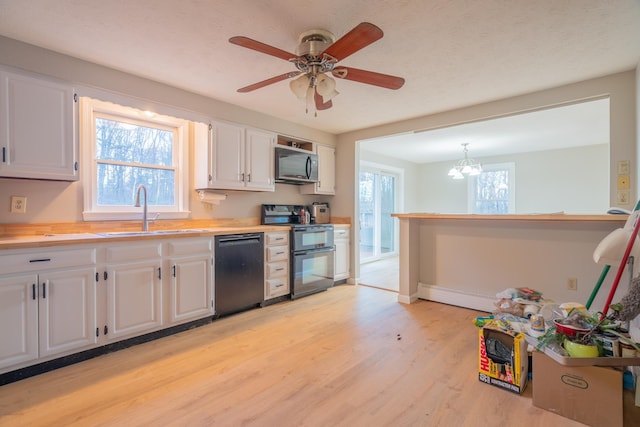 kitchen with white cabinets, dishwasher, electric stove, and sink