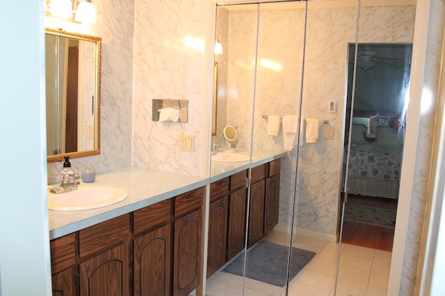 bathroom featuring tile patterned flooring and vanity