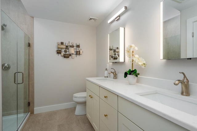 bathroom with vanity, toilet, and walk in shower