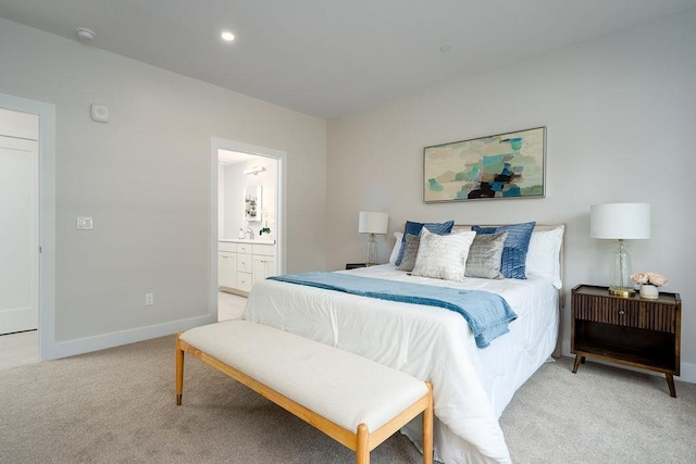 carpeted bedroom featuring ensuite bathroom