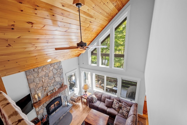 living room with hardwood / wood-style floors, high vaulted ceiling, ceiling fan, and wooden ceiling
