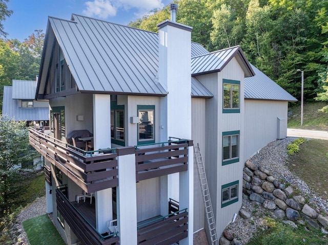 back of property with a deck