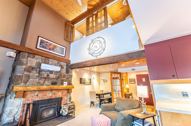 living room featuring beamed ceiling, high vaulted ceiling, and wooden ceiling