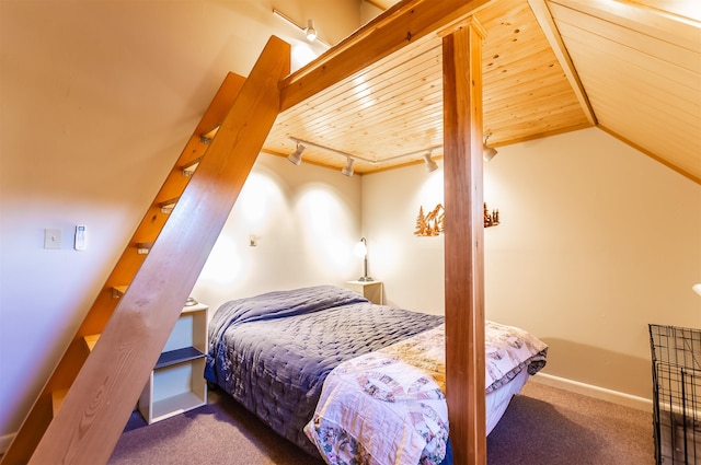 bedroom featuring lofted ceiling, dark carpet, wooden ceiling, and rail lighting