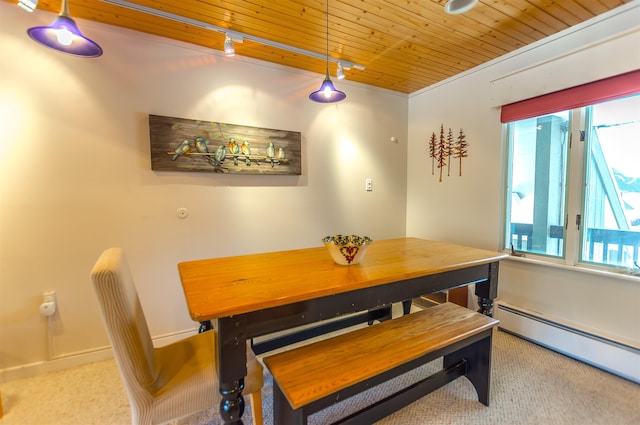 dining room featuring carpet flooring, wooden ceiling, and a baseboard heating unit