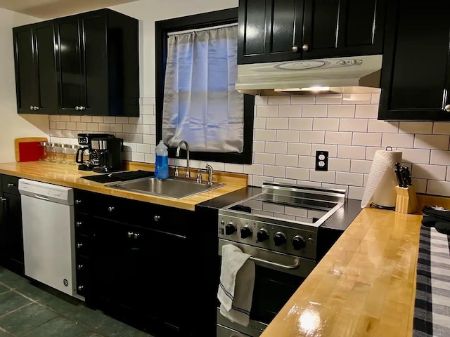 kitchen featuring wood counters, tasteful backsplash, high end stove, sink, and dishwasher