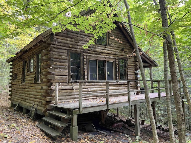 view of home's exterior with a wooden deck